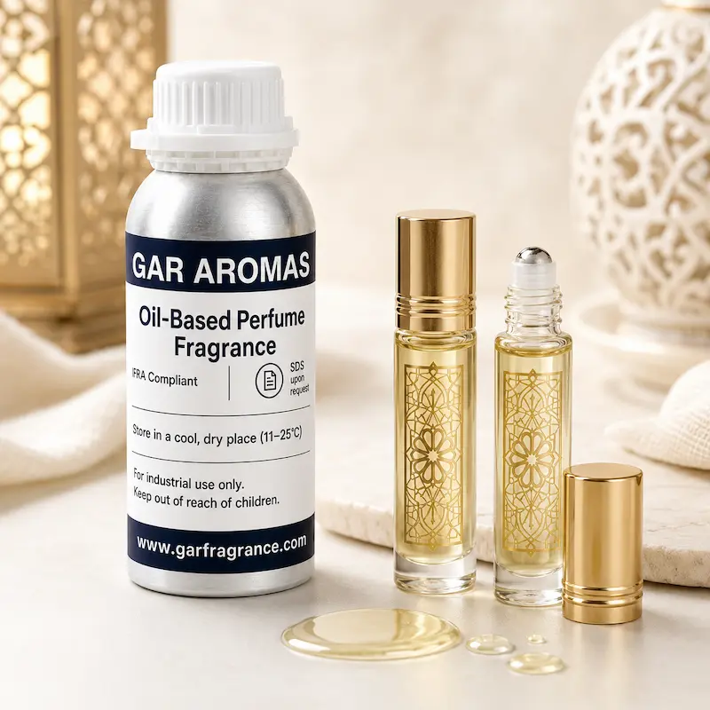 Oil-based perfume fragrance application with roll-on perfume oil bottles and pale golden fragrance oil