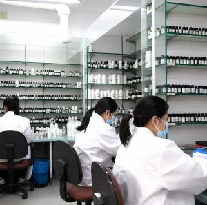 Perfumers working in a fragrance formulation laboratory with aroma materials