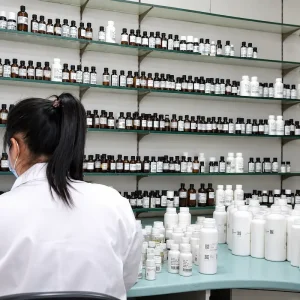 Fragrance laboratory with organized aroma materials and formulation bottles