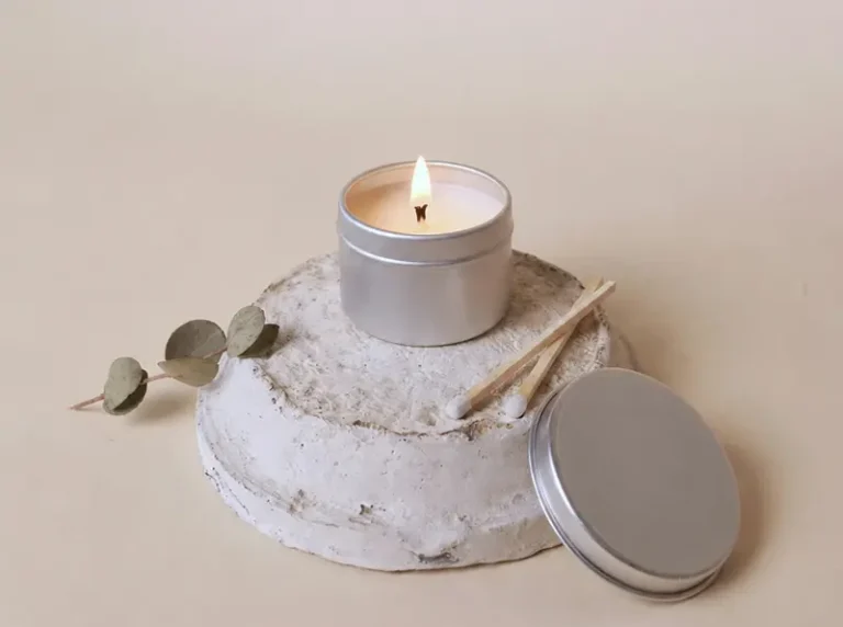Scented candle burning with candle fragrance oil for cold throw and hot throw evaluation